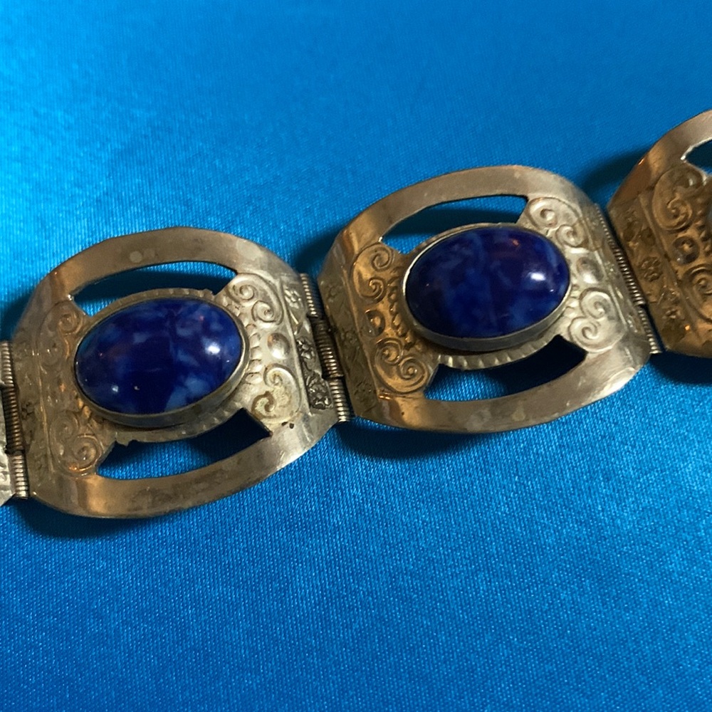 The bracelet is from Mexico. It is sliver with blue stones very old
